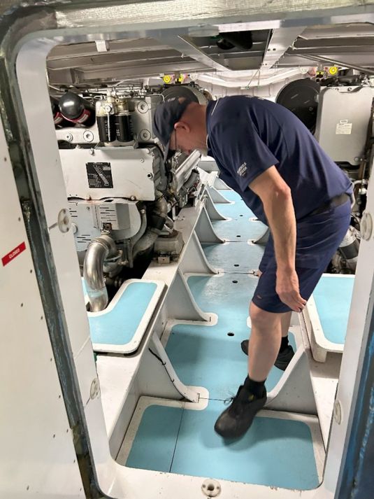 First Mate Dale McKerlie performs engine checks