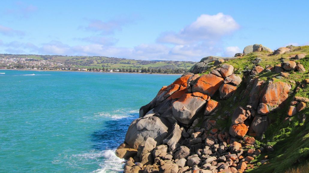 Boulders overlooking an ocean bay.